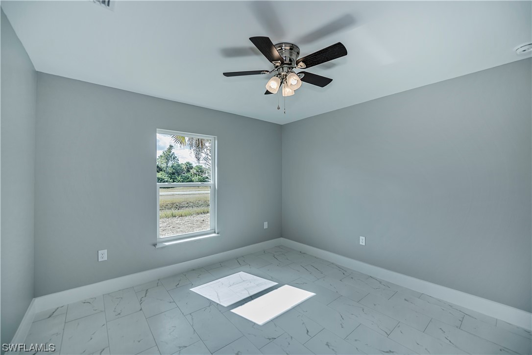 9035 West Crow Circle LaBelle, FL 33935 - Photo 31 of 32 a view of an empty room with a window
