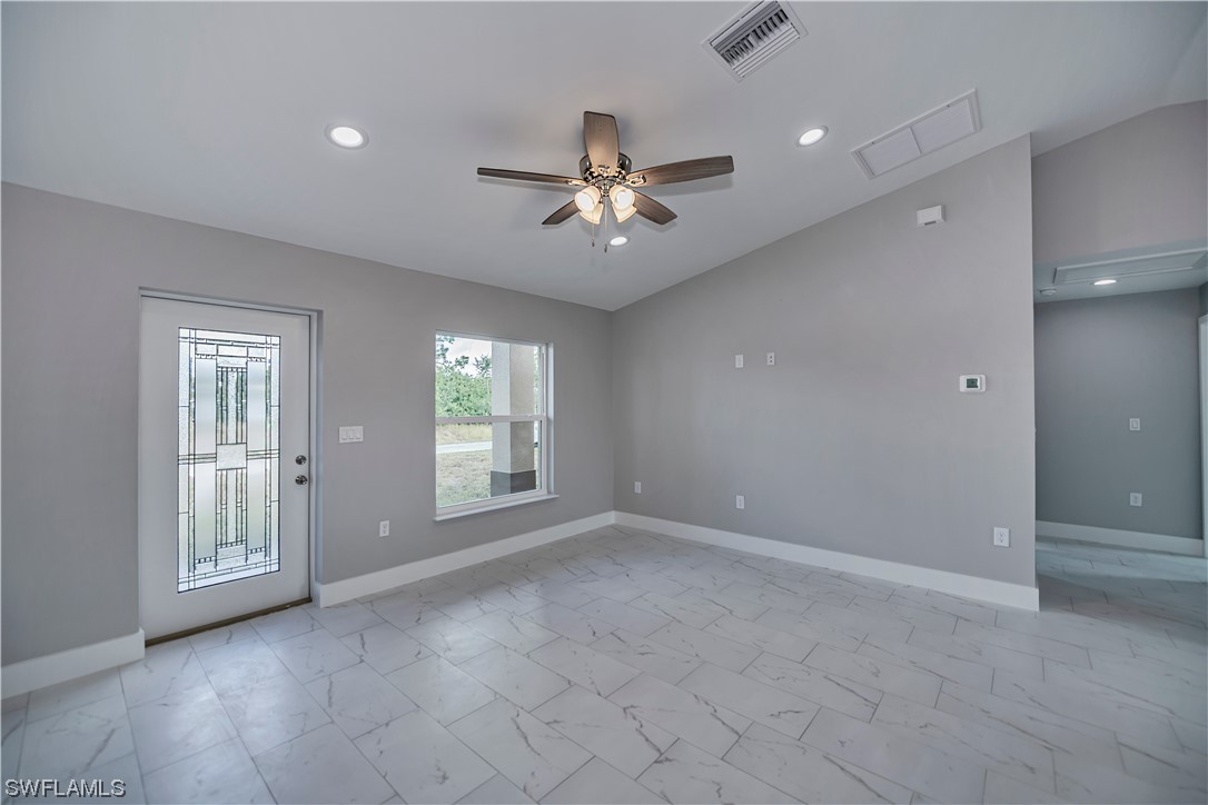 9035 West Crow Circle LaBelle, FL 33935 - Photo 4 of 32 a view of an empty room with a window