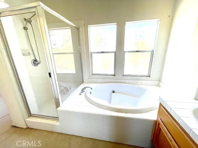 a white bath tub sitting next to a window