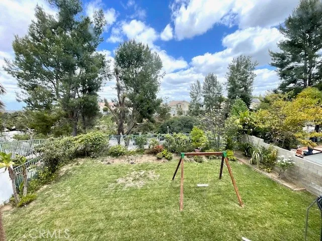 a view of yard with swimming pool
