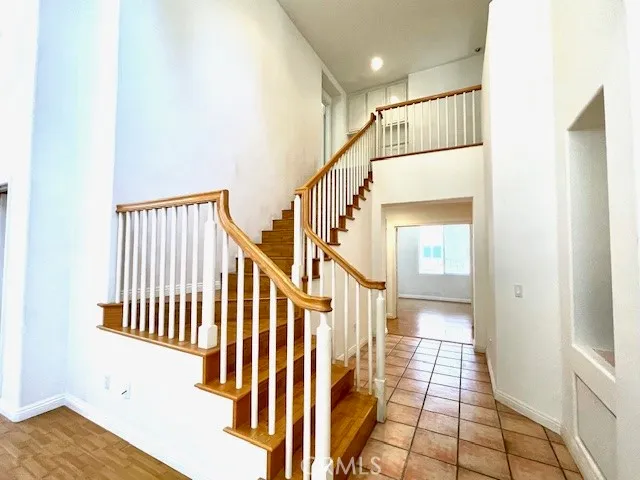 a view of staircase with white walls and a window