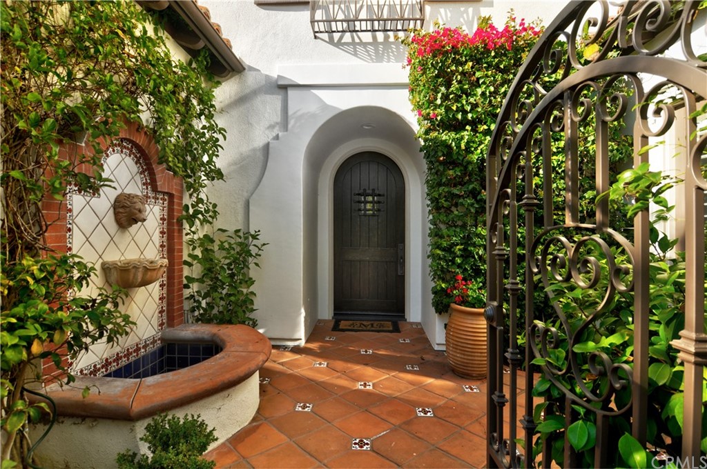 21 Catania Newport Coast, CA 92657 - Photo 3 of 5 a front view of a house with plants