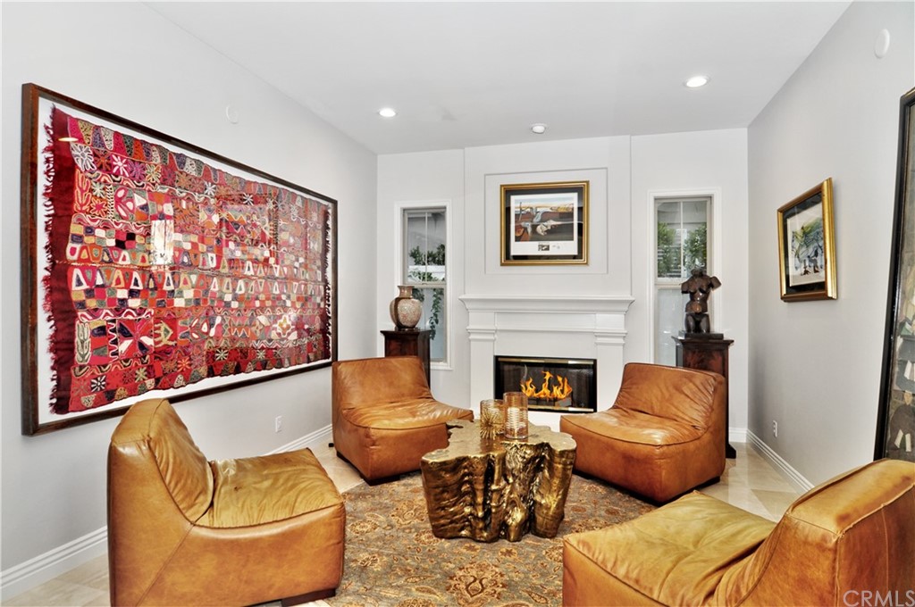 21 Catania Newport Coast, CA 92657 - Photo 4 of 5 a living room with furniture and a fireplace