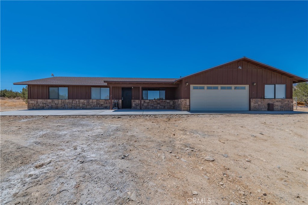1181 Barkley Ranch Road Pinon Hills, CA 92372 - Photo 11 of 37 a front view of a house with a yard