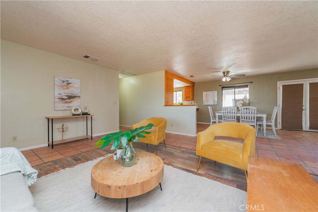 1181 Barkley Ranch Road Pinon Hills, CA 92372 - Photo 18 of 37 a living room with furniture and a wooden floor