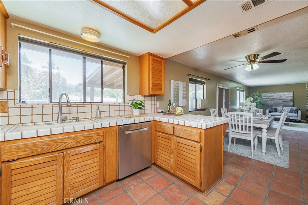 1181 Barkley Ranch Road Pinon Hills, CA 92372 - Photo 26 of 37 a kitchen with stainless steel appliances granite countertop a stove and a refrigerator