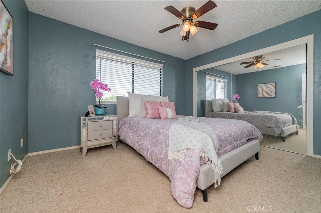1181 Barkley Ranch Road Pinon Hills, CA 92372 - Photo 31 of 37 a bedroom with a bed and window