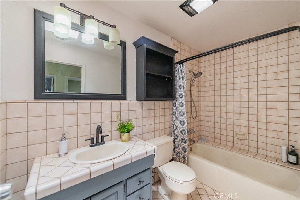 1181 Barkley Ranch Road Pinon Hills, CA 92372 - Photo 32 of 37 a bathroom with a sink a toilet and shower