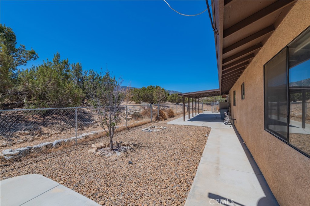 1181 Barkley Ranch Road Pinon Hills, CA 92372 - Photo 36 of 37 a view of a house with a backyard