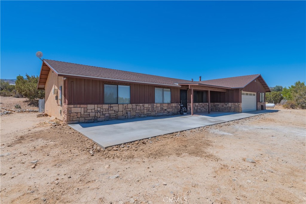 1181 Barkley Ranch Road Pinon Hills, CA 92372 - Photo 10 of 37 a view of a house with a backyard