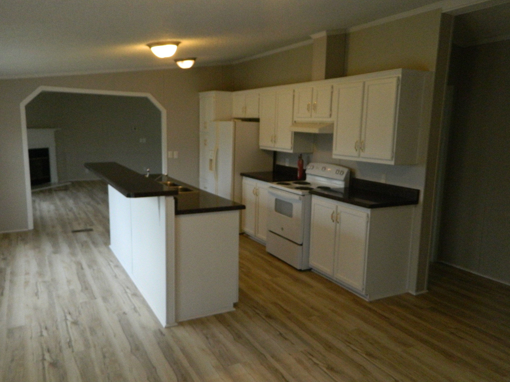 341 East Biggs Road Portland, TN 37148 - Photo 7 of 17 a kitchen with stainless steel appliances a sink a stove a refrigerator and cabinets