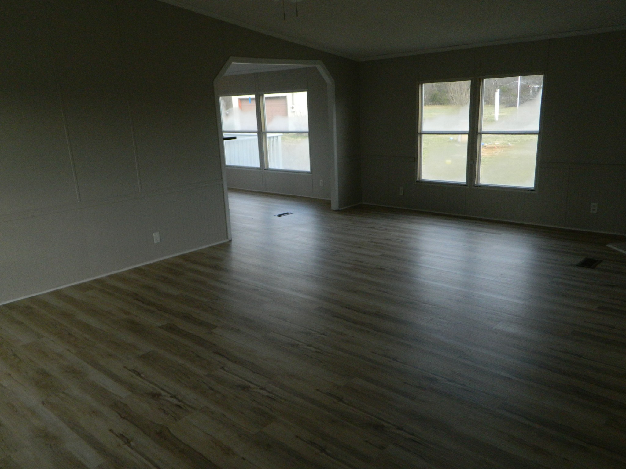341 East Biggs Road Portland, TN 37148 - Photo 10 of 17 an empty room with wooden floor and windows