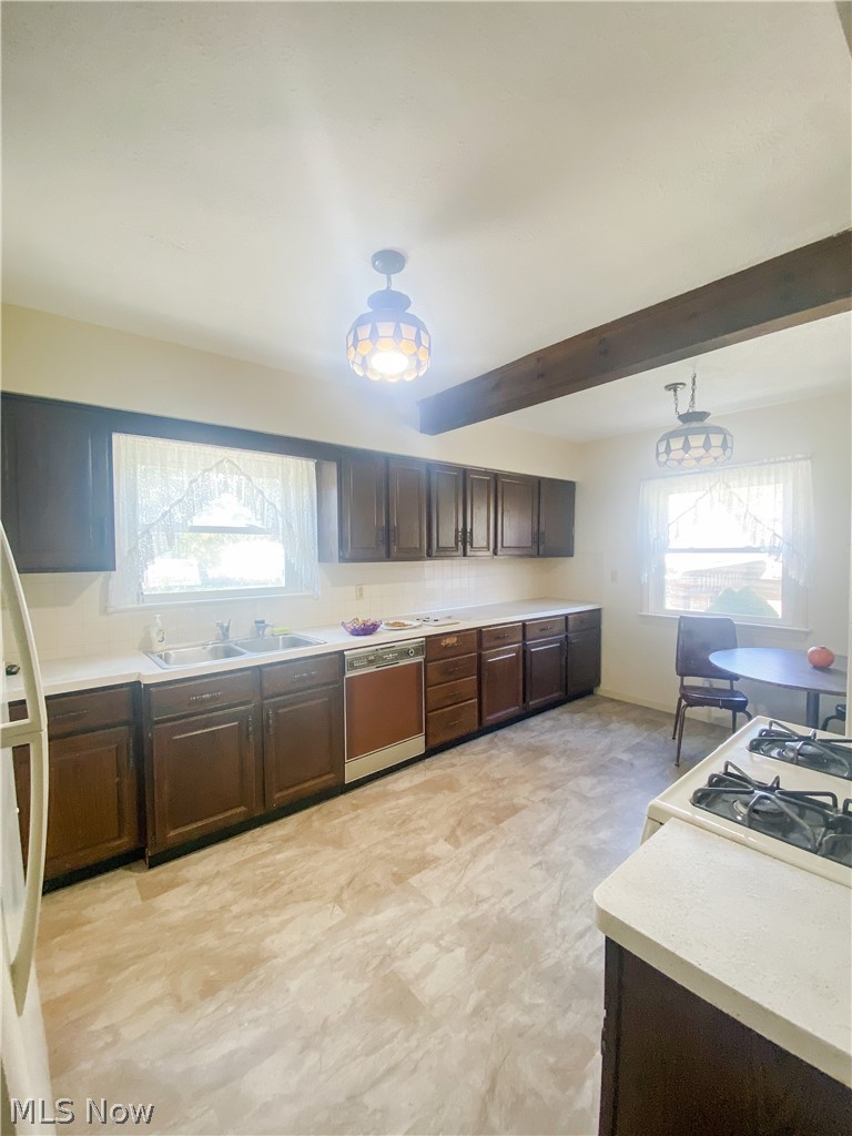 29147 Chardon Road Wickliffe, OH 44092 - Photo 10 of 31 Beautiful wooden cabinets and exposed wooden beam.