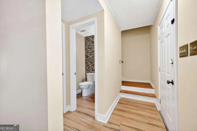 a view of a bathroom from the hallway