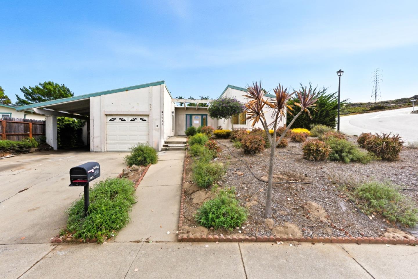 1460 Mescal Street Seaside, CA 93955 - Photo 2 of 24 a front view of a house with garden