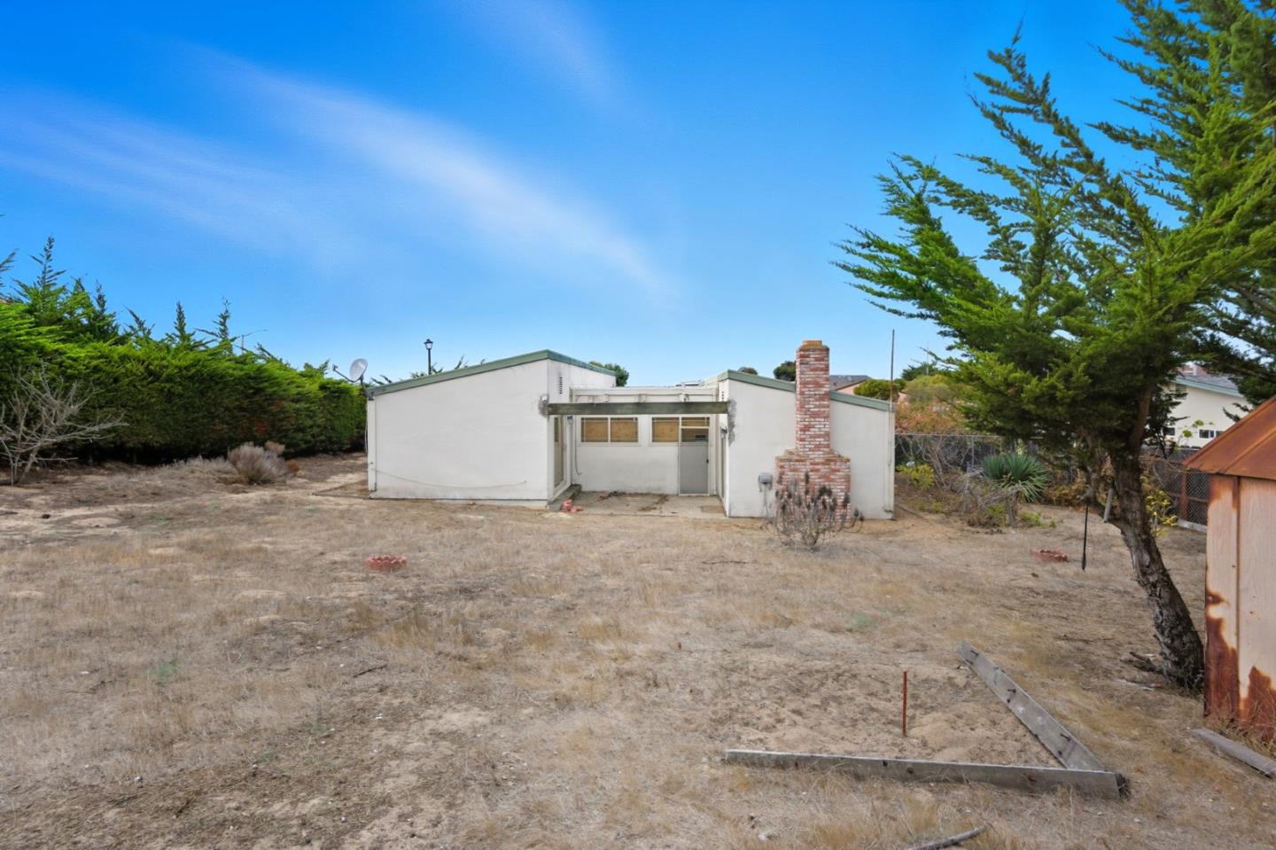 1460 Mescal Street Seaside, CA 93955 - Photo 23 of 24 a white house that has a tree in front of it