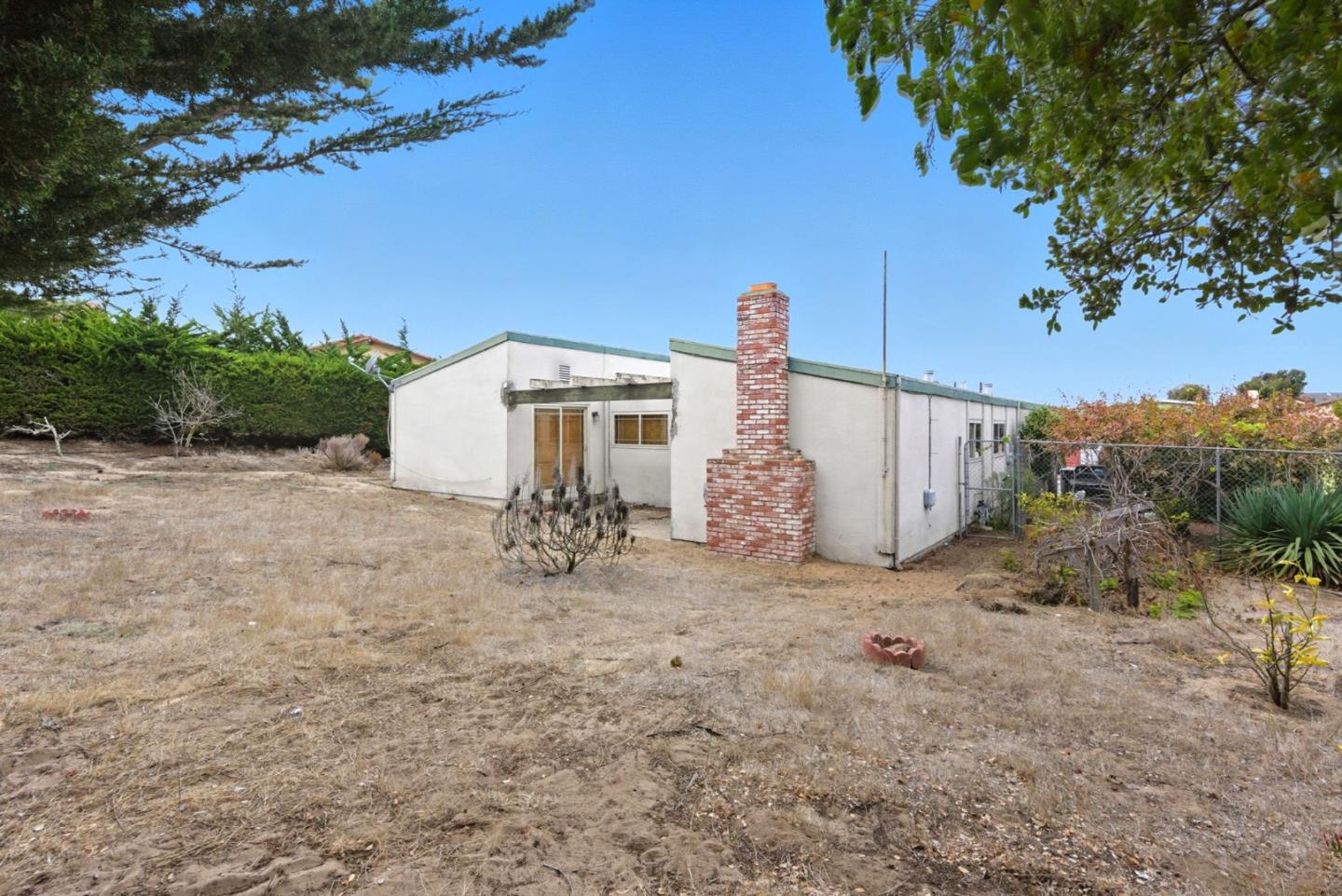 1460 Mescal Street Seaside, CA 93955 - Photo 24 of 24 a view of a dry yard with a tree