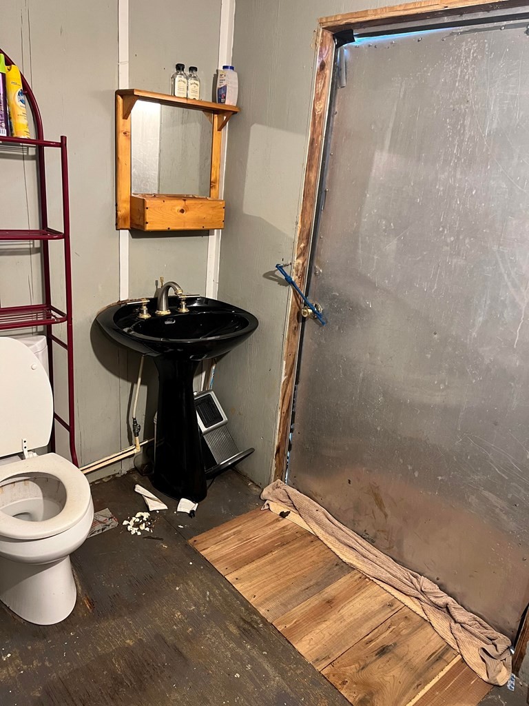 1148 Keith Valley Road Southeast Cleveland, TN 37323 - Photo 27 of 39 a bathroom with a sink toilet and shower