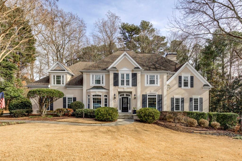320 Morgan Farm Court Sandy Springs, GA 30342 - Photo 1 of 1 a front view of a house with a yard