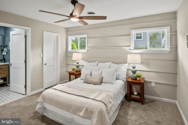 a bedroom with bed and window