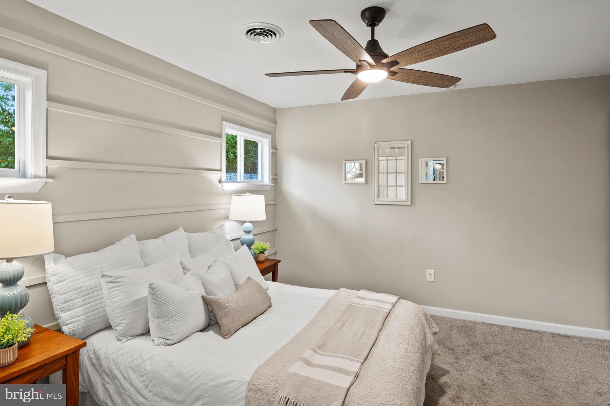 7966 Foster Avenue Severn, MD 21144 - Photo 11 of 25 a bedroom with a bed and a ceiling fan