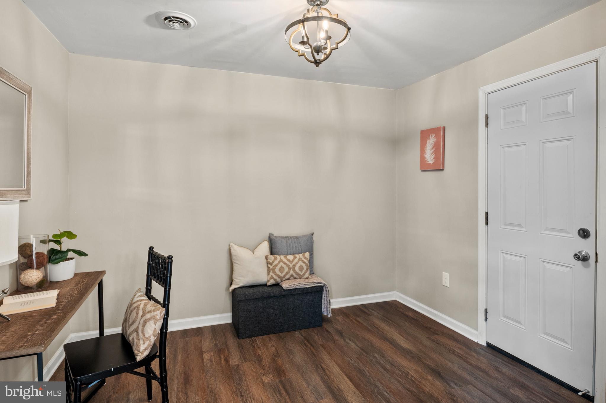 7966 Foster Avenue Severn, MD 21144 - Photo 15 of 25 a workspace with furniture and wooden floor