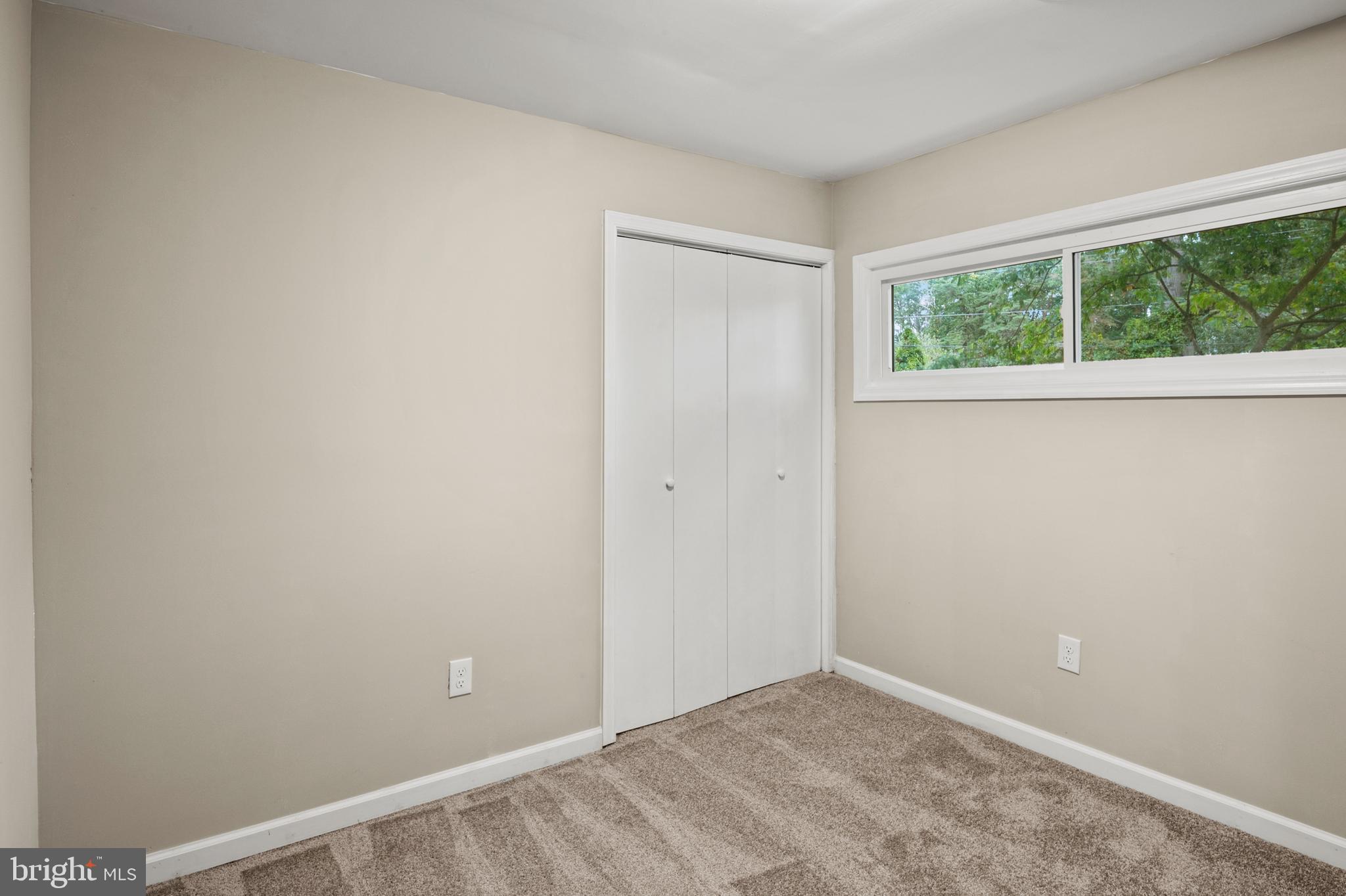 7966 Foster Avenue Severn, MD 21144 - Photo 16 of 25 an empty room with a window