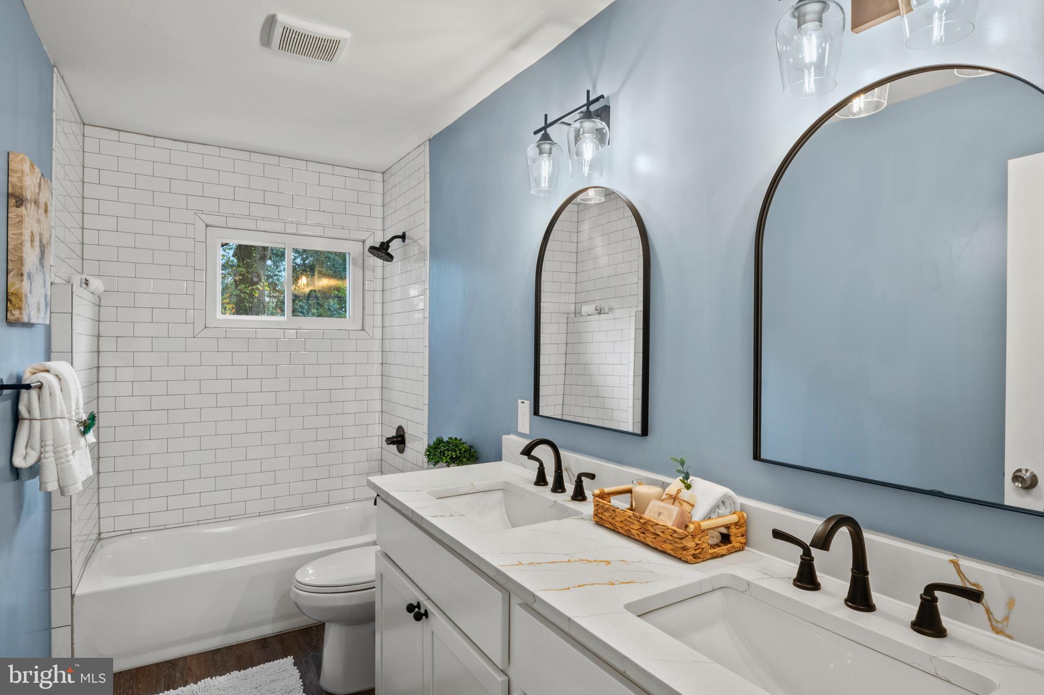 7966 Foster Avenue Severn, MD 21144 - Photo 19 of 25 a bathroom with a sink and a mirror