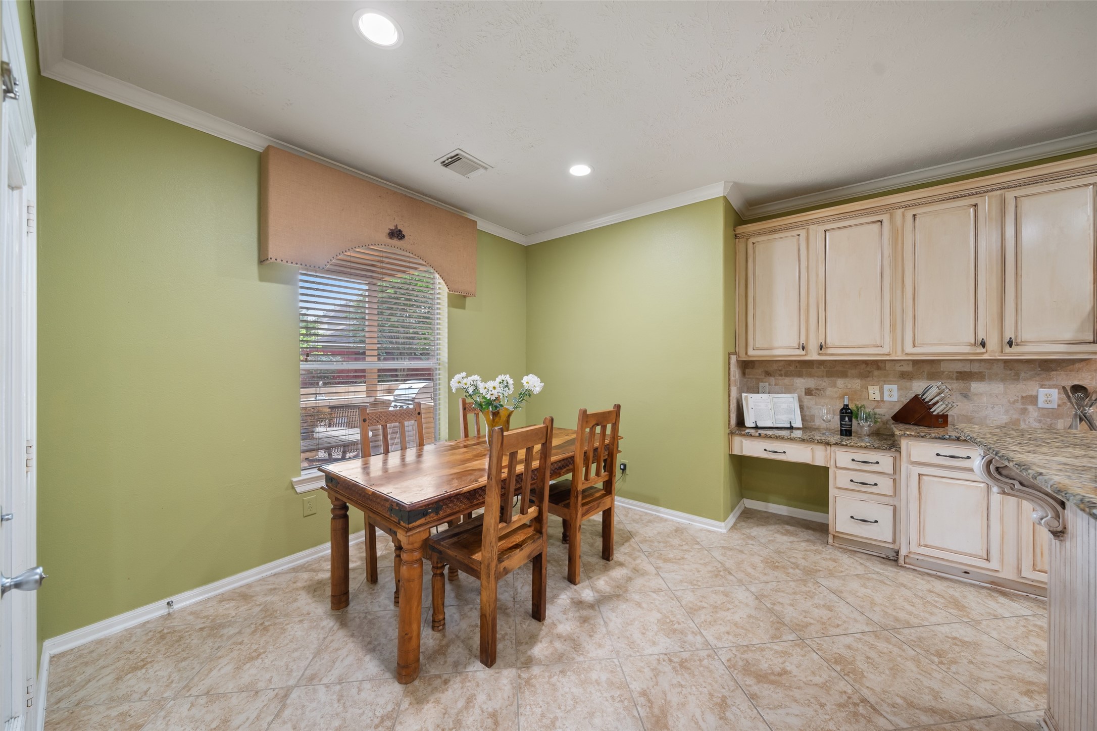 6407 Ashley Manor Drive Spring, TX 77389 - Photo 13 of 41 a view of a dining room with furniture and a window