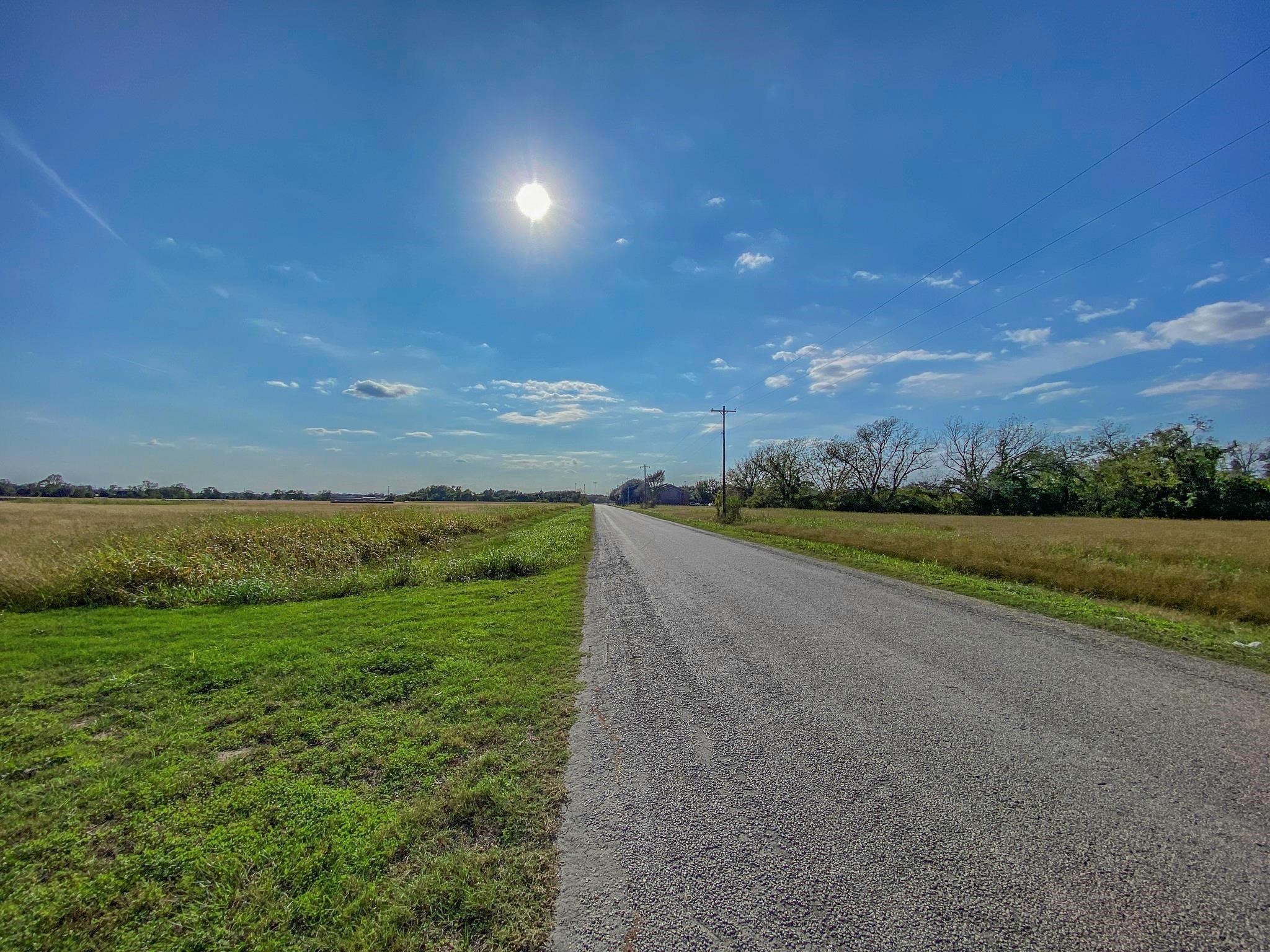 2320 County Road 166 Wharton, TX 77488 - Photo 18 of 22 a view of a big yard with an outdoor space