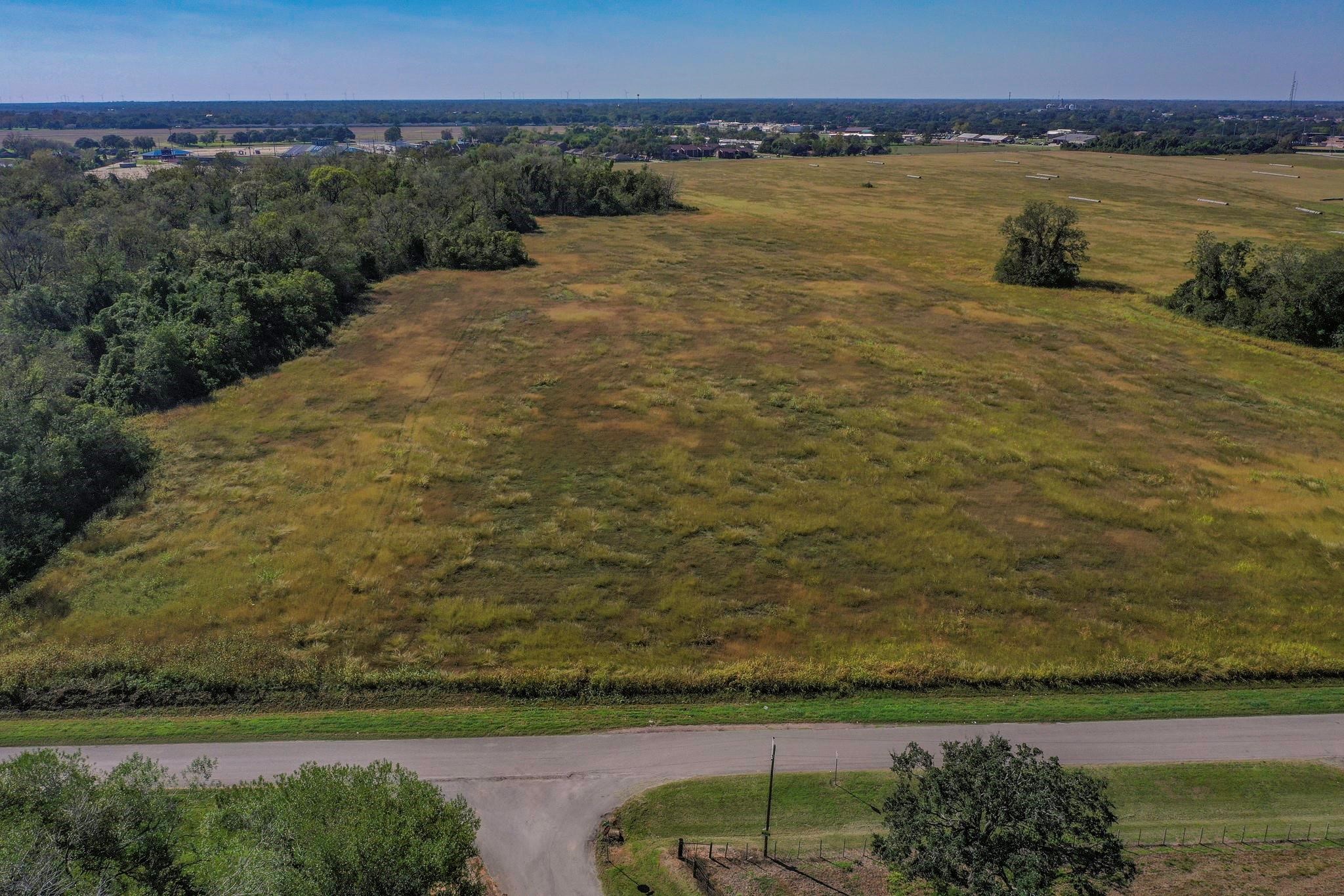 2320 County Road 166 Wharton, TX 77488 - Photo 20 of 22 a view of a lake with a yard