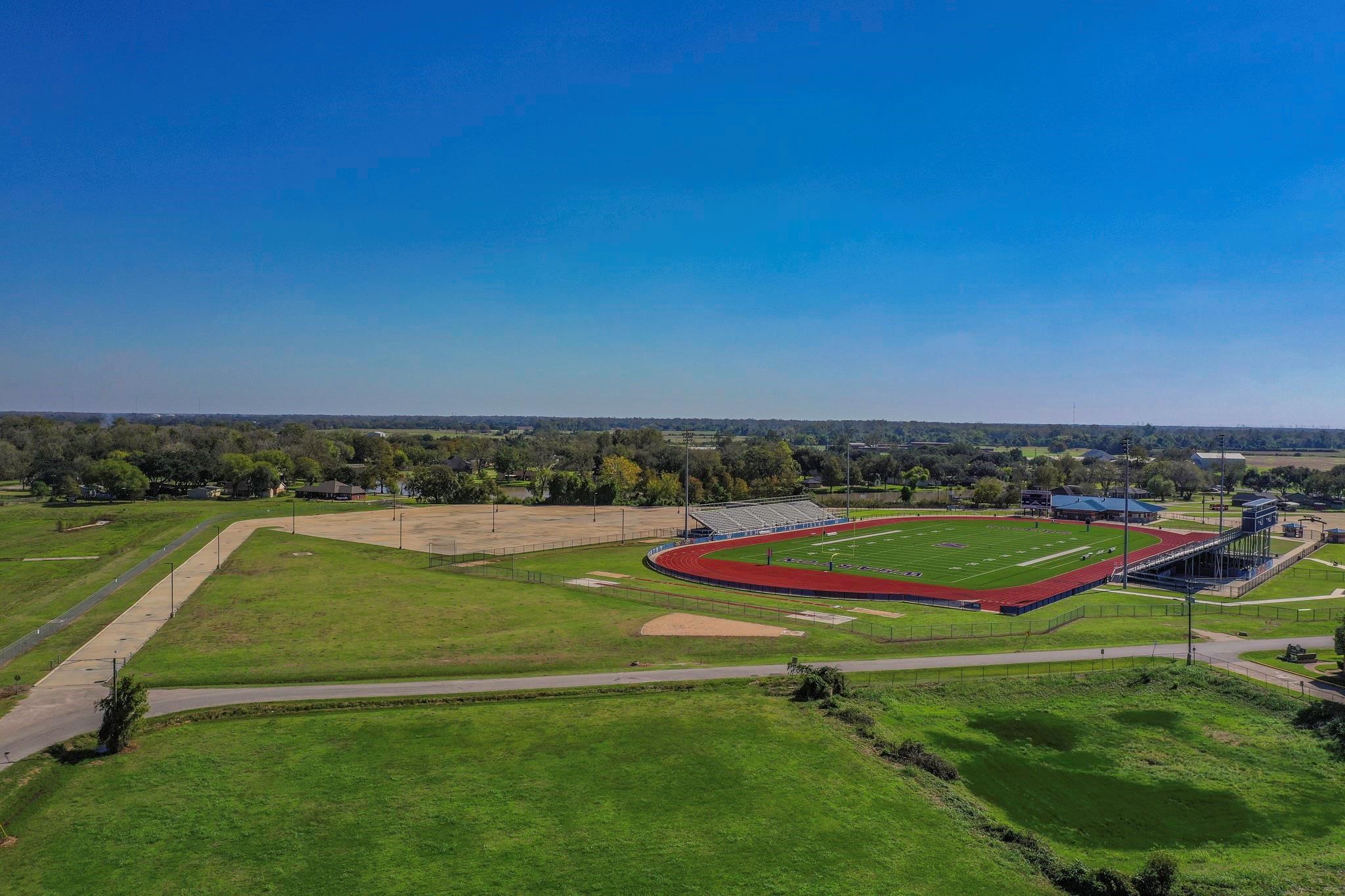 2320 County Road 166 Wharton, TX 77488 - Photo 7 of 22 a view of a swimming pool with a yard