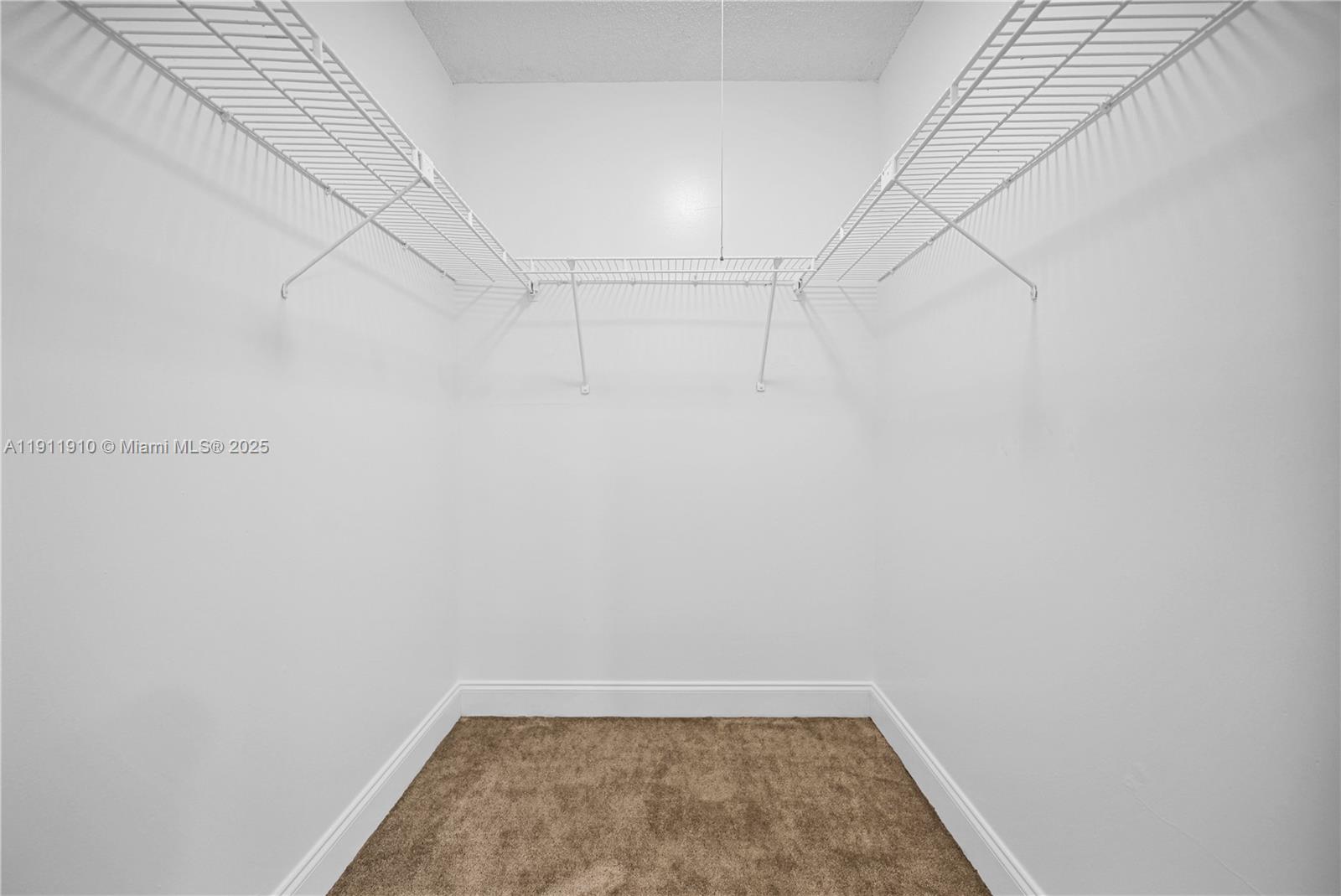 7550 Stirling Road, Unit C406 Davie, FL 33024 - Photo 14 of 27 a view of a room with racks on the wall