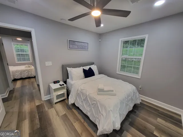 a bedroom with a bed and window