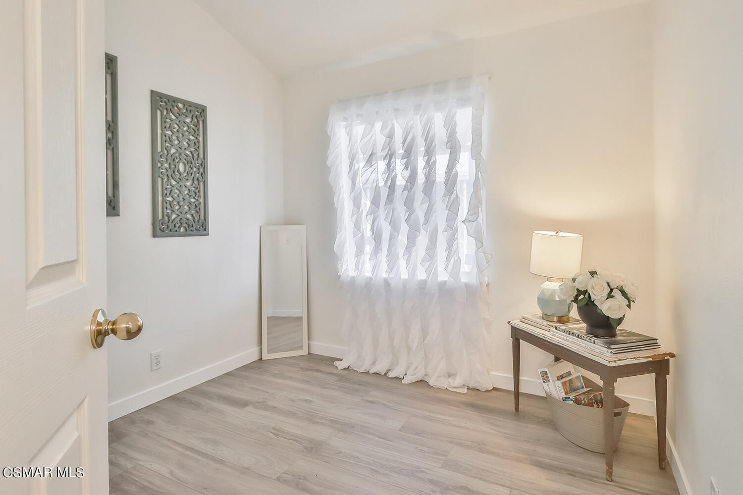 2168 Thrush Avenue, Unit 2168J Oxnard, CA 93033 - Photo 18 of 37 a room with window and a wooden floor