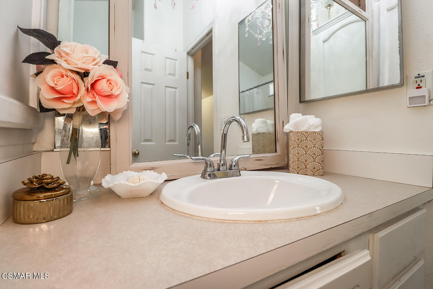 2168 Thrush Avenue, Unit 2168J Oxnard, CA 93033 - Photo 22 of 37 a bathroom with a sink and a mirror