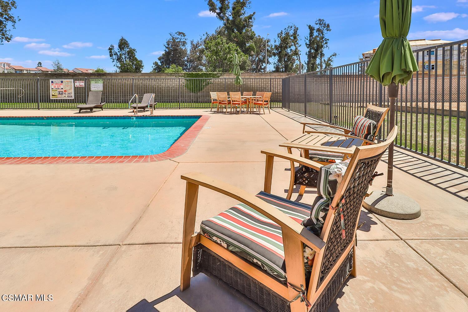 2168 Thrush Avenue, Unit 2168J Oxnard, CA 93033 - Photo 33 of 37 a view of a patio with a table and chairs