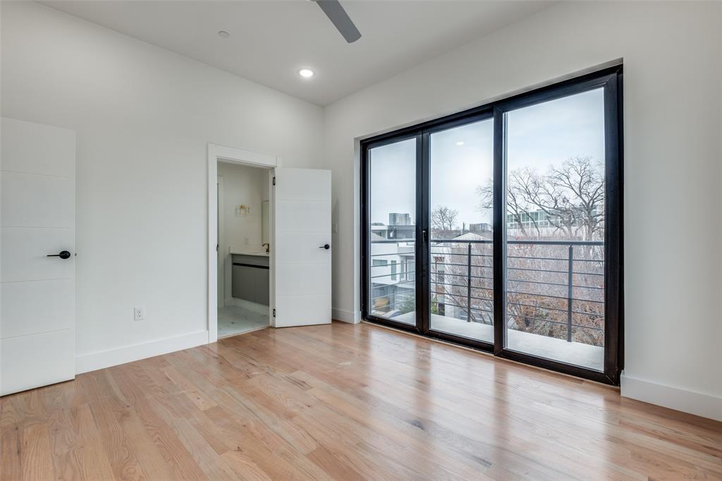 2613 Calvin Street, Unit 12 Dallas, TX 75204 - Photo 15 of 23 wooden floor in an empty room with a window