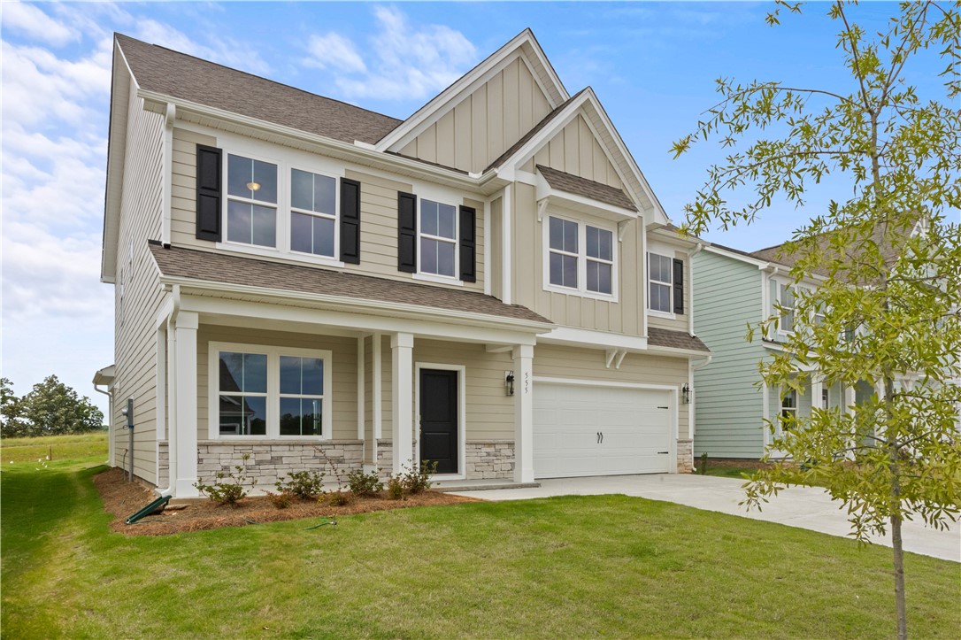 555 Hydrangea Street, Unit LOT 47 Seneca, SC 29678 - Photo 2 of 38 A traditional two-story home with a pristine lawn awaits its next homeowner.