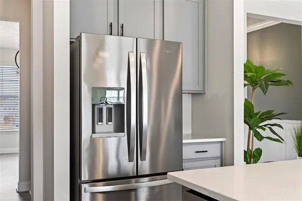 a kitchen with stainless steel appliances granite countertop a lot of counter space and cabinets