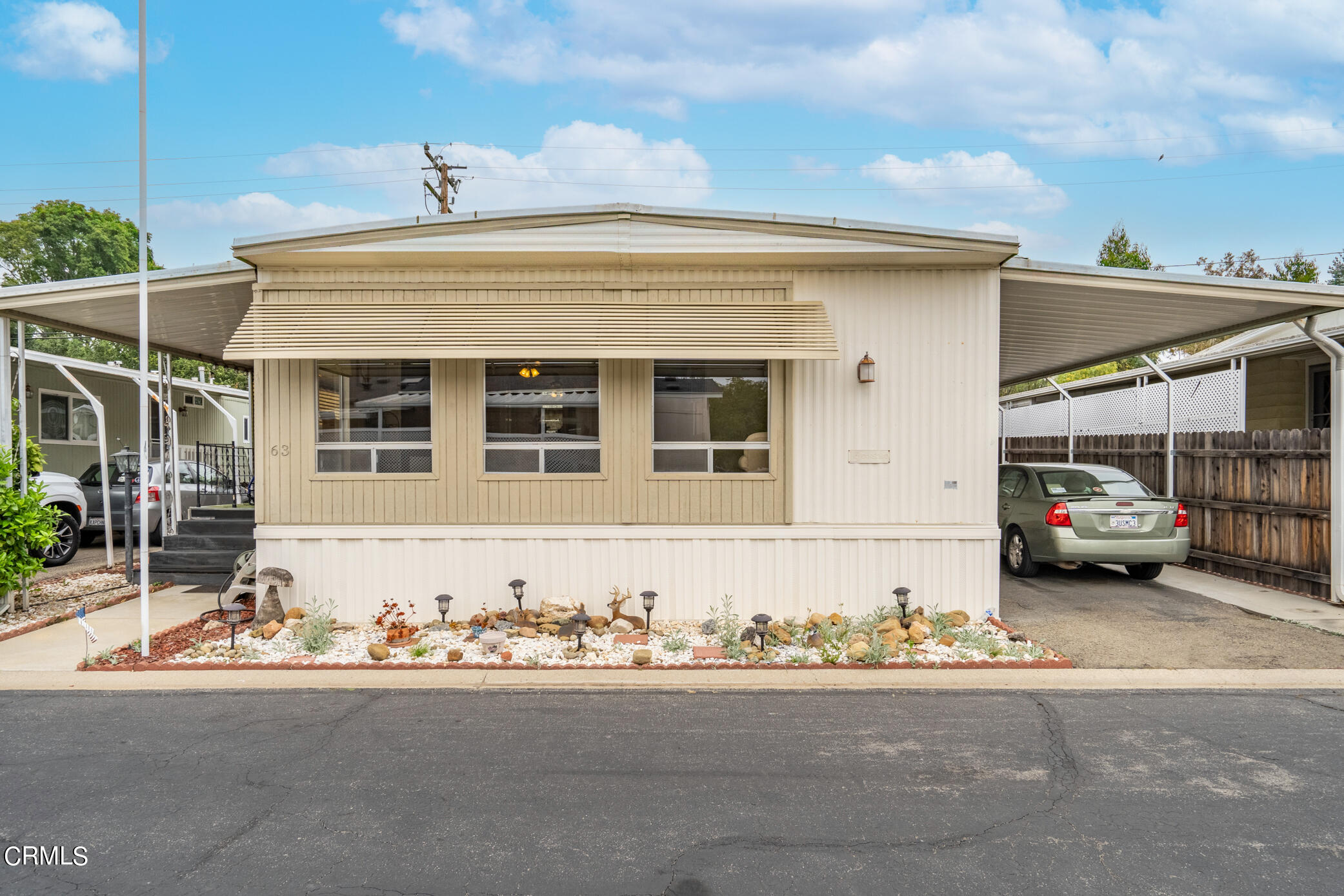 1225 South Rice Road, Unit 63 Ojai, CA 93023 - Photo 20 of 23 a car parked in front of a house