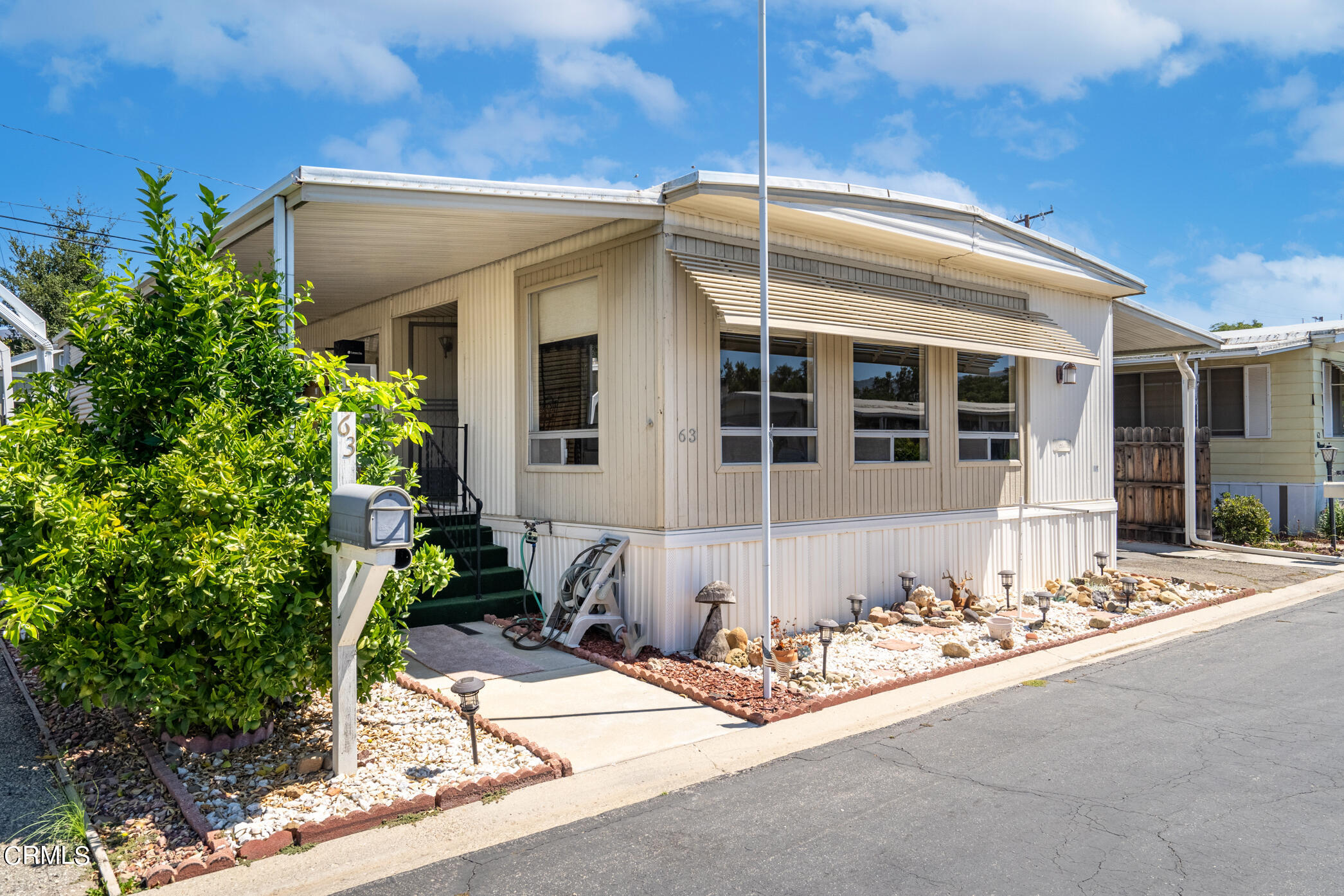 1225 South Rice Road, Unit 63 Ojai, CA 93023 - Photo 2 of 23 a front view of a house with a patio