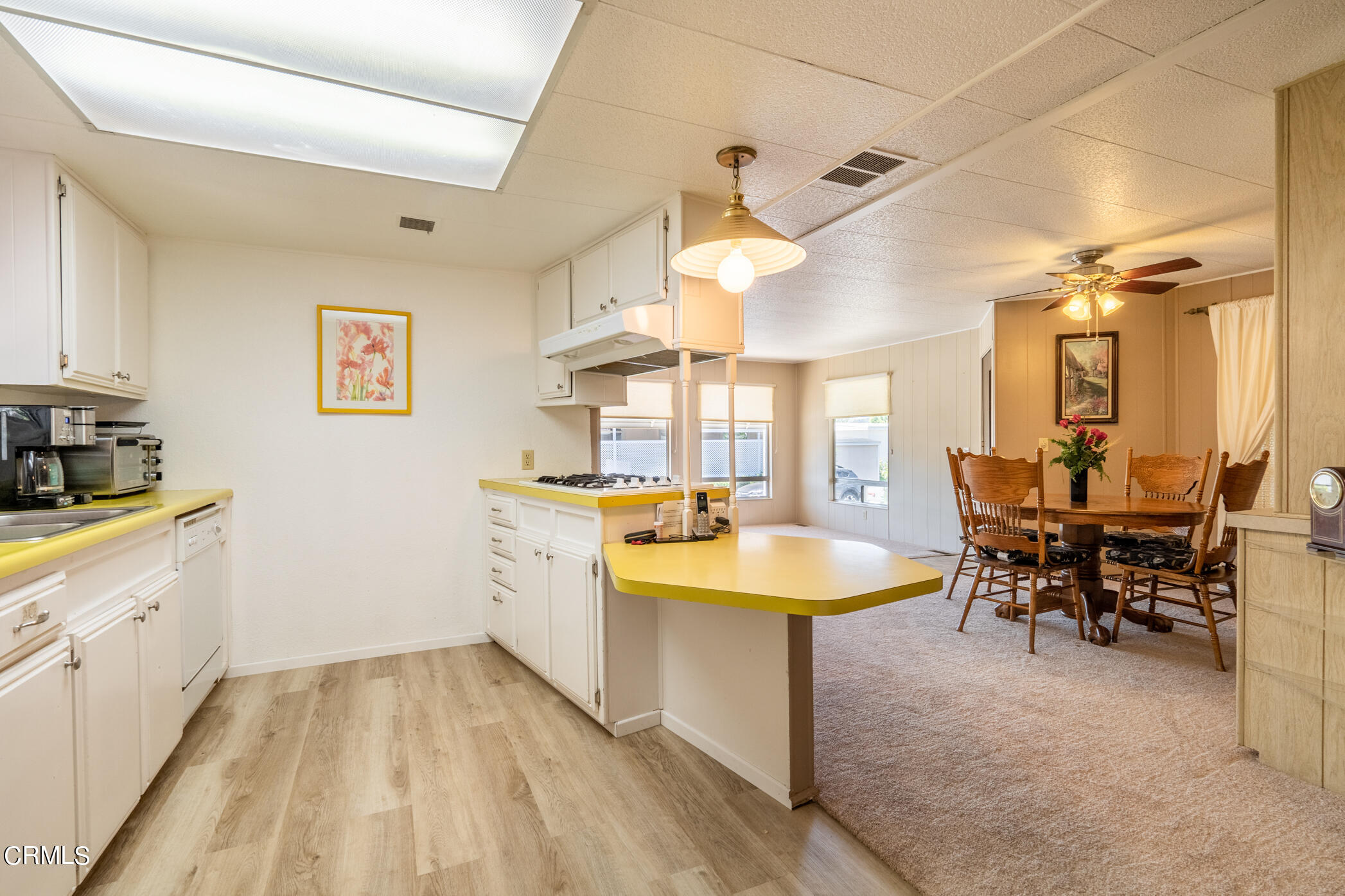 1225 South Rice Road, Unit 63 Ojai, CA 93023 - Photo 6 of 23 a large white kitchen with a large window