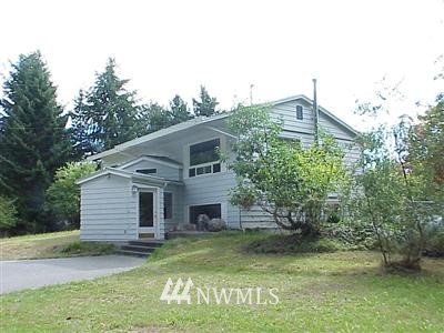 11933 Southwest Cove Road Vashon, WA 98070 - Photo 1 of 1 a view of a house with a yard