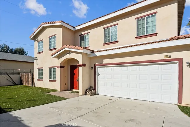 a front view of a house with yellow lighting on it