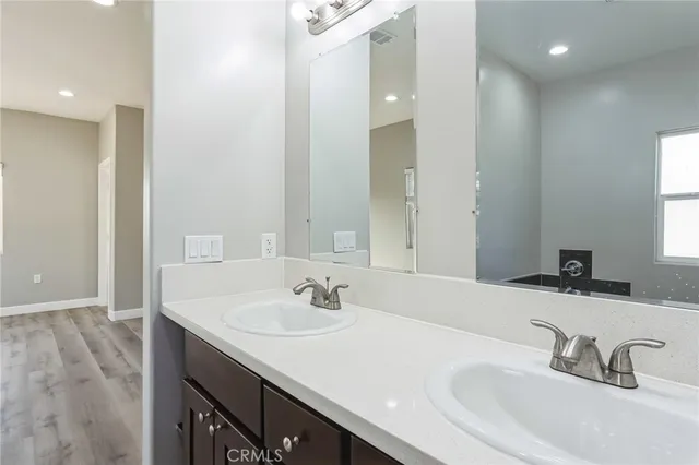a bathroom with a sink and a large mirror
