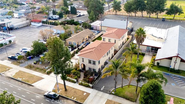 an aerial view of residential houses with outdoor space