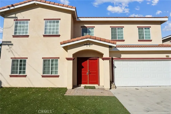 front view of a house with a yard