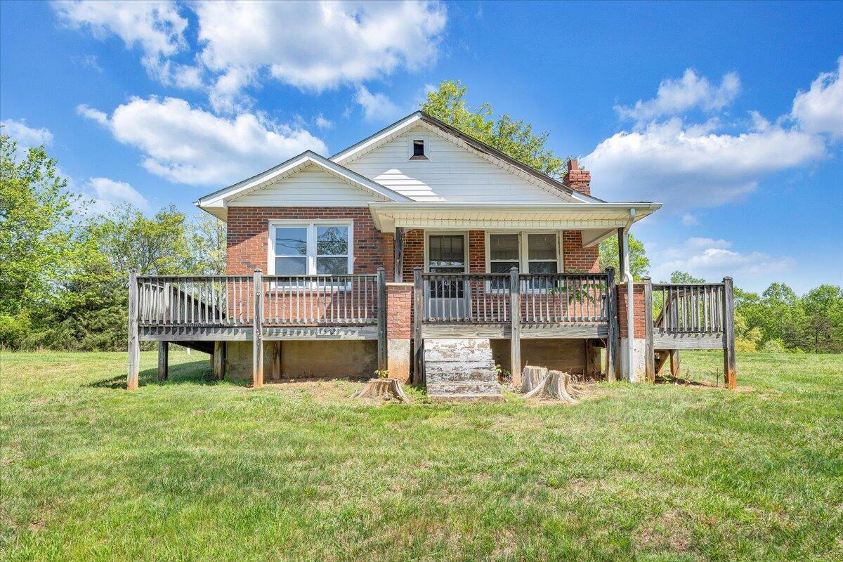 15723 Moneta Road Moneta, VA 24121 - Photo 2 of 38 a view of a house with a yard and a deck