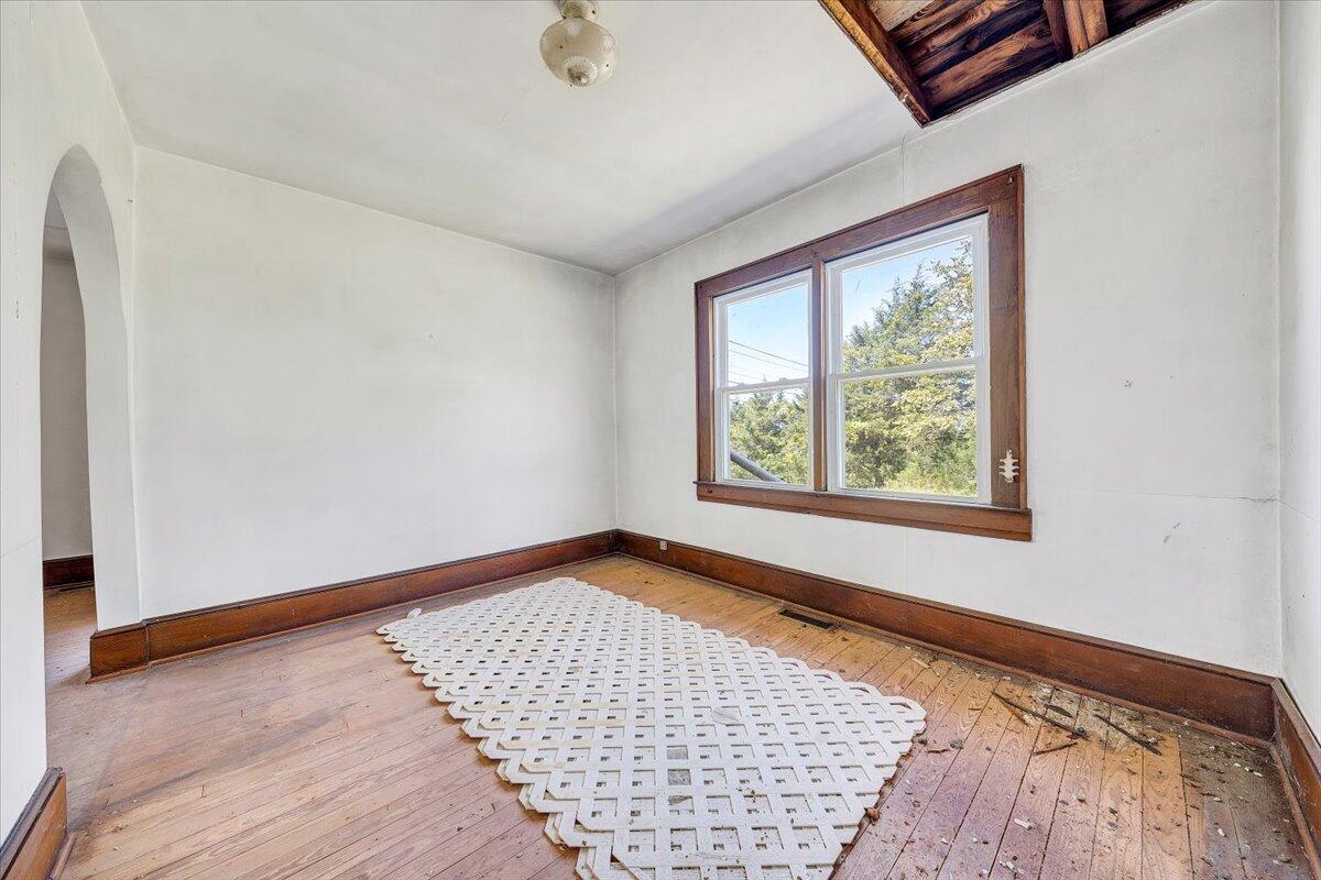 15723 Moneta Road Moneta, VA 24121 - Photo 28 of 38 an empty room with wooden floor and windows